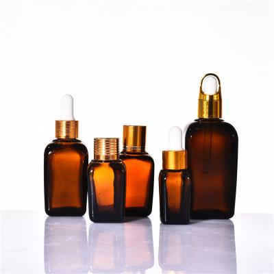 China Amber Square 10ml Cosmetic Wholesale Oil Bottle Essential Oil Direct Sales Dropper Glass Bottle 10lm 20ml 30ml 50ml 100ml for sale