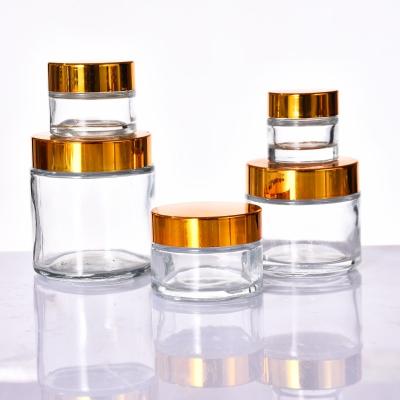 China Customized Cosmetic Products 10g 15g 20g 30g 50g 100g Clear Glass Cream Jar With Gold Cap for sale