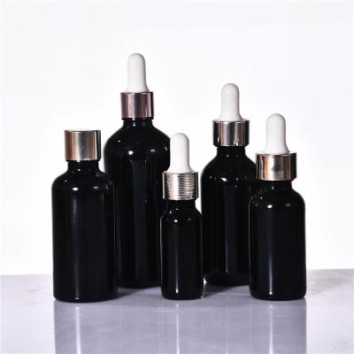 China Best-selling 10ml 15ml 20ml 30ml 50ml 100ml 5ml Black Cosmetic Oil Rotary Dropper Factory Cap Drying Dropper Bottle for sale