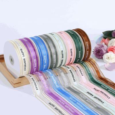 China Custom Logo 100% Polyester Metallia Edge Name Printed Logo Organza Ribbon for packing Decoration for sale