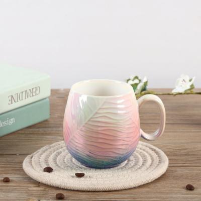 China Unique Viable Restaurant Office Milk Water Color Glazed Round Fancy Embossed Ceramic Bulk Luxury Coffee Mugs for sale