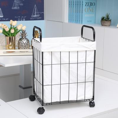 China 2020 Sustainable Handmade Wrought Iron Laundry Baskets With Foldable Wheels Lined for sale