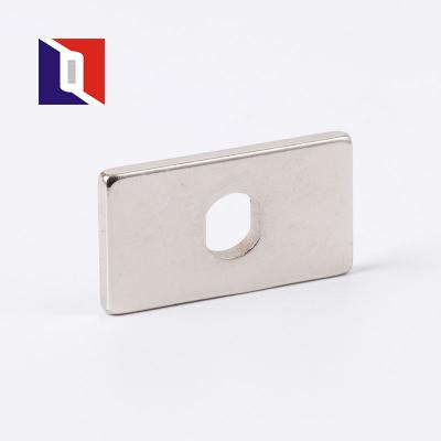 China Custom Industrial Magnet Shape Block Neodymium Magnet With Hole For Big Door for sale