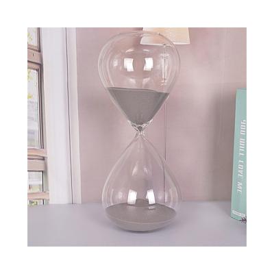 China Bulk Sand Modern Hot Sale Cheap Small Transparent Glass Clock for sale