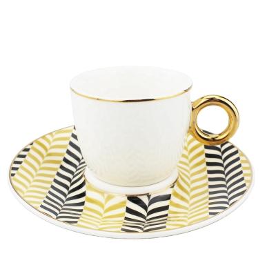 China Viable European Style 80ml Luxury Gold Plated Yellow Cup and Black Ceramic Saucer Coffee Tea Set Afternoon Tea Set in Cup for sale