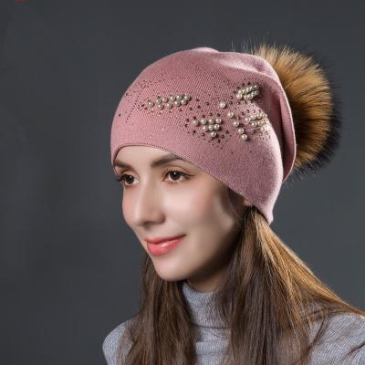 China Wholesale Dobby Raccoon Fur Pom Pom Hat Ladies Beanie Winter Warm Knitted Flip Hats Crochet Hats for sale