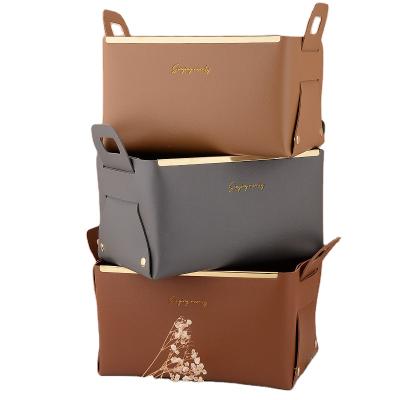 China Viable Leather Storage Box Collapsible Storage Basket With Handle Skin Care Cosmetics Snacks Sundries Storage Basket for sale