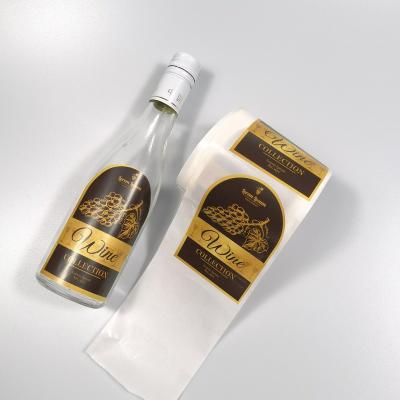 China Waterproof Gold Foil Embossed Private Printing Waterproof Adhesive Adhesivas Etiquetas Rose Red Wine Label Packaging Wine Bottle Sticker for sale