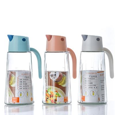 China Europe Wholesale Oil Can Automatic Opening And Closing Household Oil Bottle Handle Clear Glass Seasoning Bottle Kitchen for sale