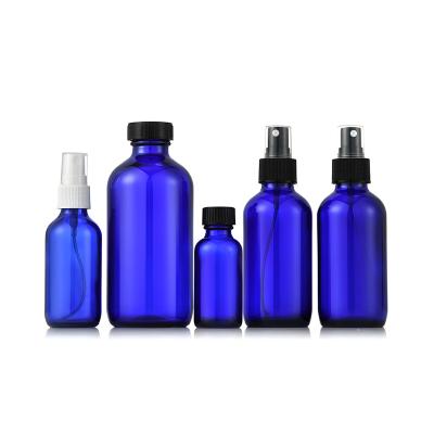 China Glass Products Production Of 30ml60ml Blue Empty Glass Essential Oil Round Bottles for sale