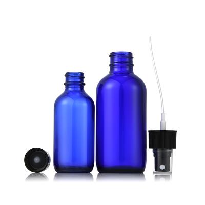 China Essential oil blue glass dropper bottle vacuum pump round bottle glass products production for sale