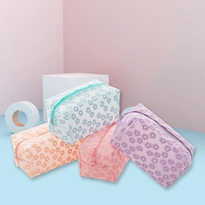 China 2021 fashion needlepoint cosmetic bag women clear small embroidery flower sweep lady bags makeup bag for sale