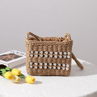 China 2021 Fashion Trendy Straw Bag Girls Popular Bead Beach Bag Woven Handmade Cross - Body Bag for sale