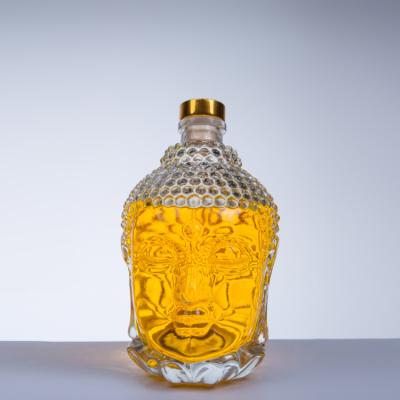 China Food Grade 750ml Buddha Thickened Transparent Wine Bottle With Water Well Cover for sale