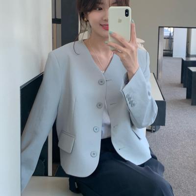 China Anti-Wrinkle Long Sleeve Collarless Button Decoration Woman V-Neckline Short Blazer With Pockets for sale