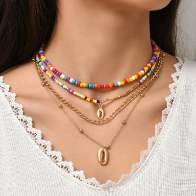 China TRENDY Bohemian Fashion Gold Shell Metal Clavicle Chain Colorful Creative Rice Bead Multilayer Necklace Accessories For Women for sale