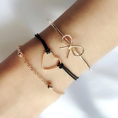 China Trendy Gold Jewelry Accessories Fashion Love Alloy Handmade Hollow Women Charm Heart Bow Bracelets Set For Girl for sale