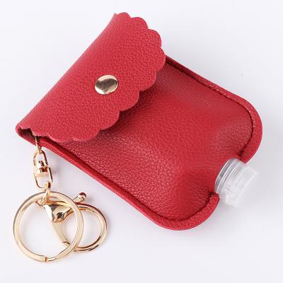 China 30ML Leather Sublimation Leather Travel Hand Sanitizer Bottle Key Chain Holder for sale