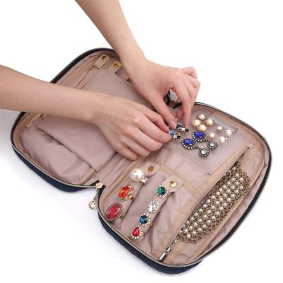 China Velvet Jewelry Organizer Case Travel Jewelry Storage Packaging Bag Pockets for sale