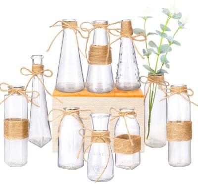 China Beautiful traditional modern clear glass vase tall set of 10 with rope design and different unique shapes for home decoration for sale