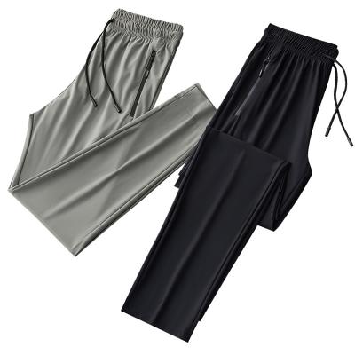 China Anti-wrinkle ice silk quick-drying pants men's large size thin breathable high-elastic air conditioning pants casual sports pants for sale