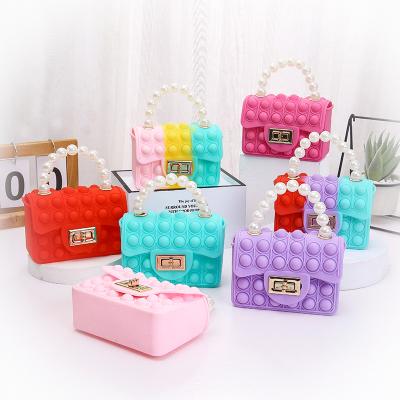 China Viable sling silicone fidgety person handbag jelly tote bag mini sling kids pop itting bags for girls for sale