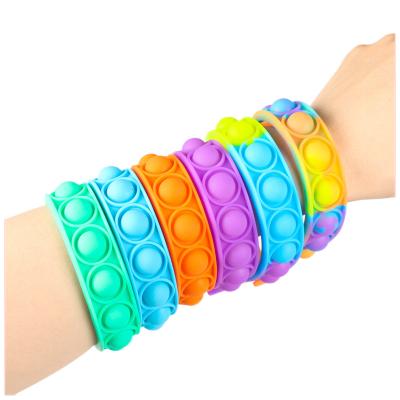 China Wearable Button Wristband Finger Watch Silicone Push Up Bubble Prompty Person Toy Wristband Sensory Rainbow for sale