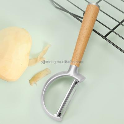 China Sustainable Kitchen Tools Vegetable Peeler Stainless Steel Peeler With Wooden Handle for sale