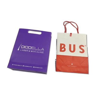 China Handmade Custom Printing Purple Shopping Paper Bags For Clothes for sale