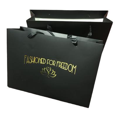 China Handmade White Gold Foil Logo Printing Paper Bag With Handle for sale