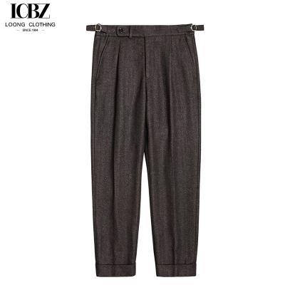 China Pantalones de lana de herringbone de botón británico de París para hombres de otoño e invierno en venta