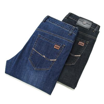 China Calças jeans rasgadas pretas personalizadas para homens com tecido de alongamento e rock revival em estilo bootcut à venda