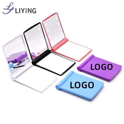 China Logo Hand Mirror Success Customized Lighted Foldable Led Makeup Cosmetic Mirror With 8 Led Light for sale