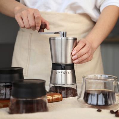 China Adjustable Frozen Manual Coffee Bean Grinder Ceramic Stainless Steel Core Mill Portable Small Hand Coffee Grinder for sale