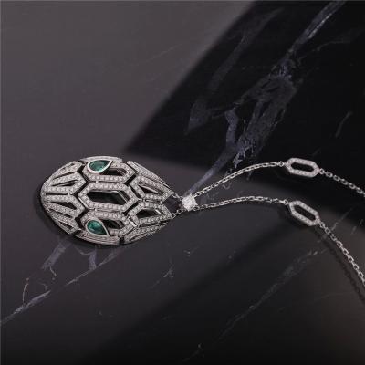 China Serpenti 18K Pendant Necklace White Gold With Emerald Eyes And Pavé Diamonds for sale