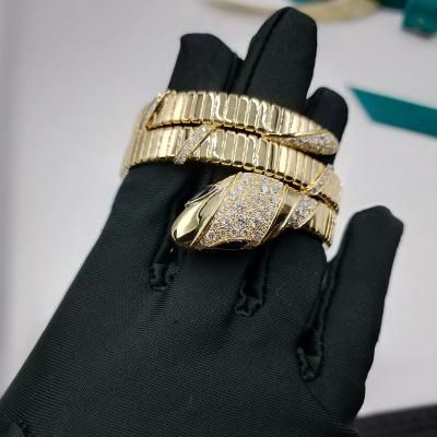 China 18K Oro Lujo Diamante Brazalete Serpenti Dos bobinas 18 Kt Oro Amarillo Brazalete Con Demi Pavé Diamantes Y Ojos de Ónix Negro en venta