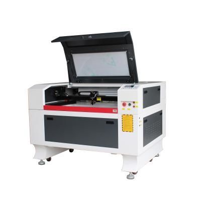 China Laser Marking CO2 CNC Laser Cutting Machine Price Table Top Laser Cutter 1390 for sale