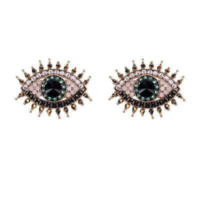 China Fashionable USA Vintage Small Full Rhinestone Rhinestone Eye Stud Earrings For Women Girls Wholesale for sale