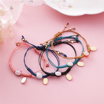 China FASHIONABLE Korean Handmade Adjustable Rope Chain Weave Small Cat Charm Bracelets For Girls Kids Gifts for sale