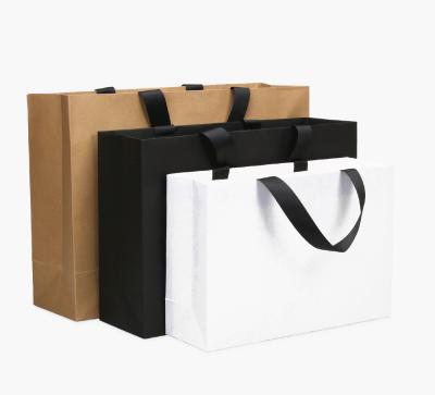 China Recycled Biodegradable Boutique Brown Paper Shopping Bags Handle Bulk Kraft Paper Bags for sale