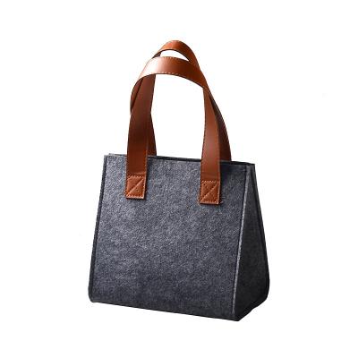 China Handled felt bag with leather handles new design simple fashionable felt shopping bag in hangbags for sale