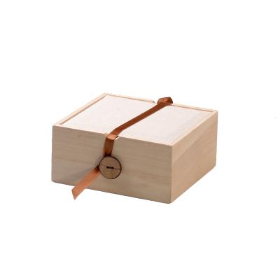 China Handmade paulownia wood box with top and buttons bracelet canvas gift box for sale