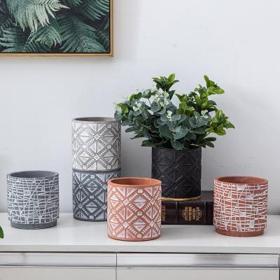 China Modern Nordic simple cylindrical concave-convex texture painted breathable cement flower pot ceramic vase set for sale