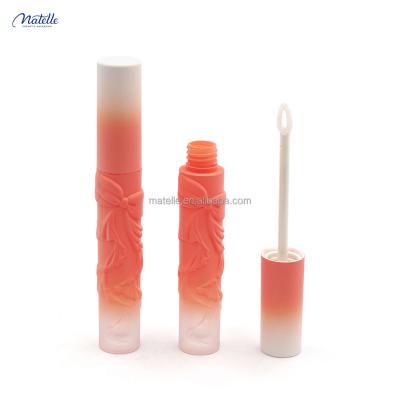 China Hot sale matte light orange tube 3ml cosmetic style soft touch flower embossing lip gloss tube for sale