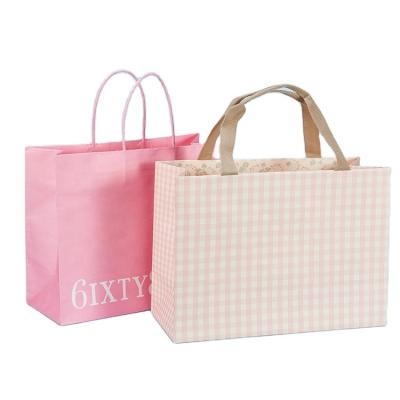 China Recycled Materials Hot Sale White Cardboard Custom Your Own Logo Print Shoes Clothing Paper Bag With Drawstring Handles for sale