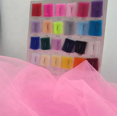 China Breathable Organza Fabric 24 Colors 100% Tulle Nylon Fabric For Wedding Decoration Dress Dress for sale