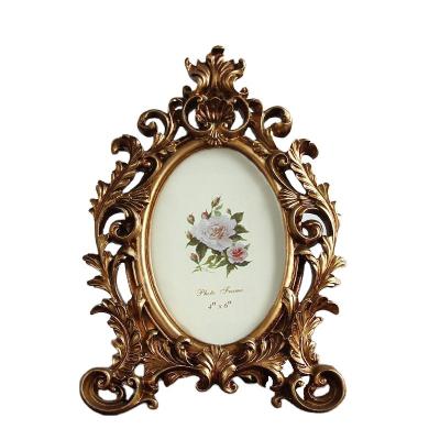 China Enviornmental Materials Retro Oval Photo Frame Resin Desktop Picture Frame Wedding Party Gold Photo Frame for sale