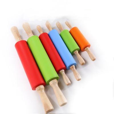 China Viable Non-Stick Silicone Rolling Pin Wooden Handle Pastry Dough Flour Roller Kitchen Baking Tool For Pasta Cookie Dough for sale