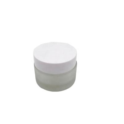 China Cosmetic popular 20g frosted clear glass jars with plastic lid for cosmetic for sale