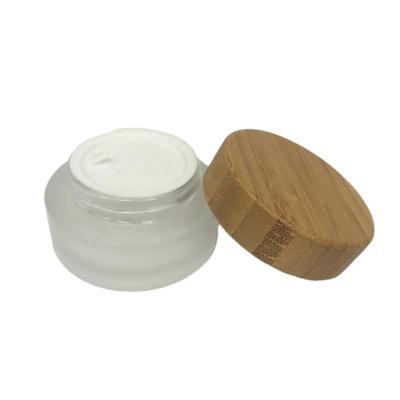 China Popular 20g Skin Care Cream Frosted Glass Jars With Bamboo Lid For Cosmetic for sale